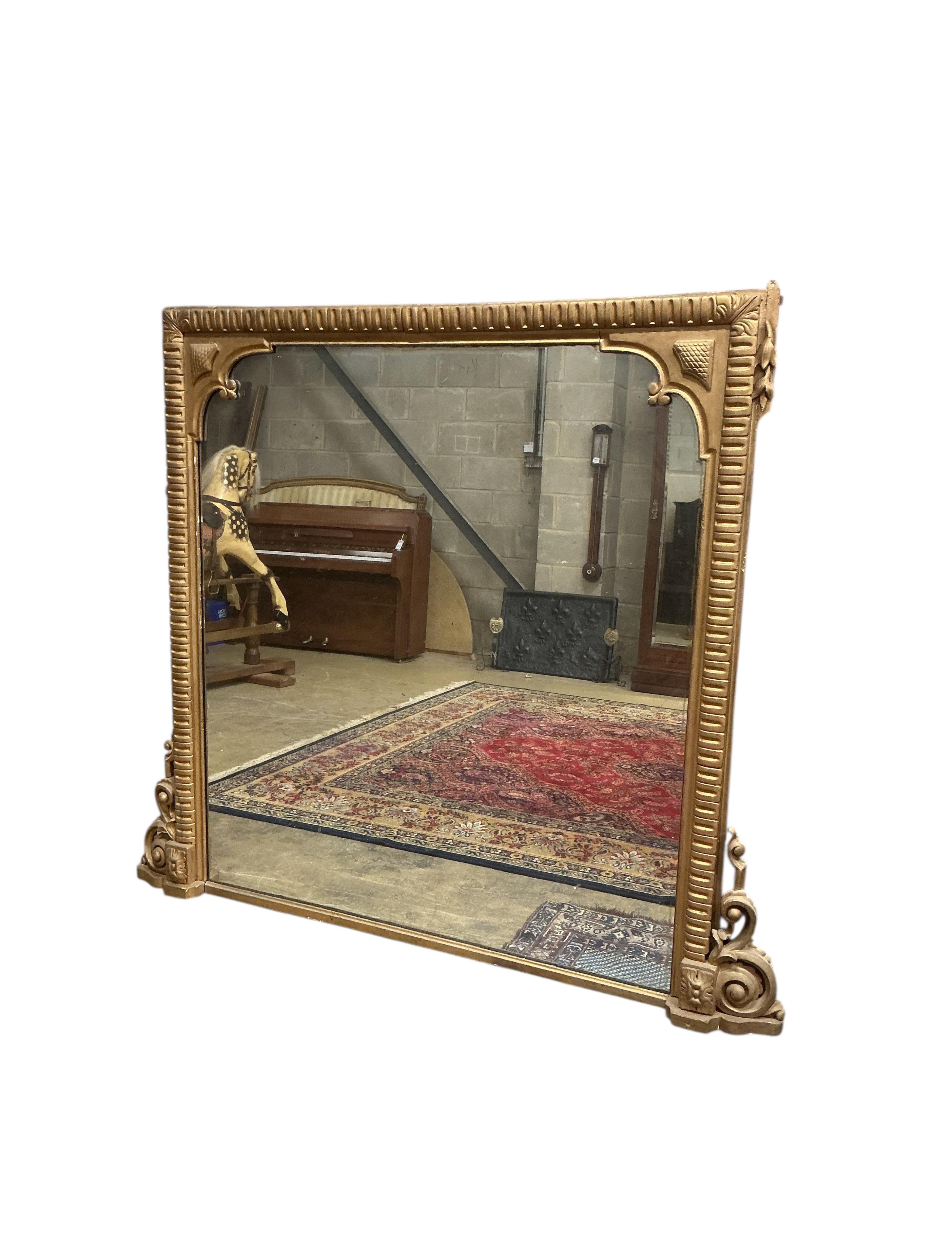 A large Victorian giltwood and composition overmantel mirror, width 170cm, height 150cm